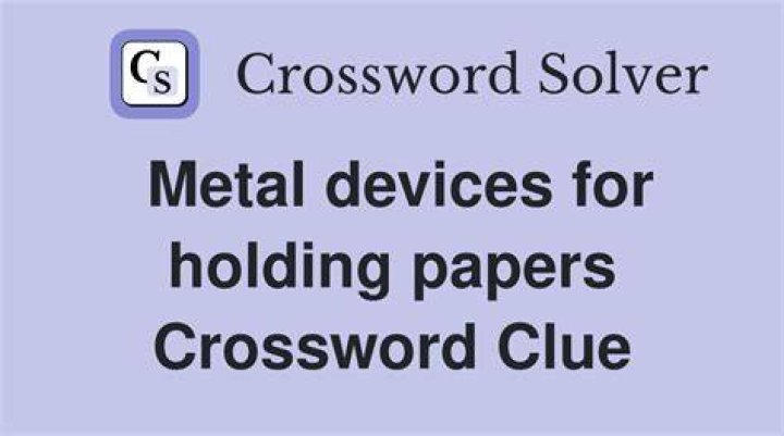 *Device for holding papers together Crossword Clue