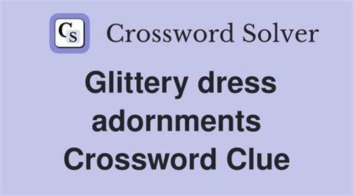 Glittery dress adornments Crossword Clue
